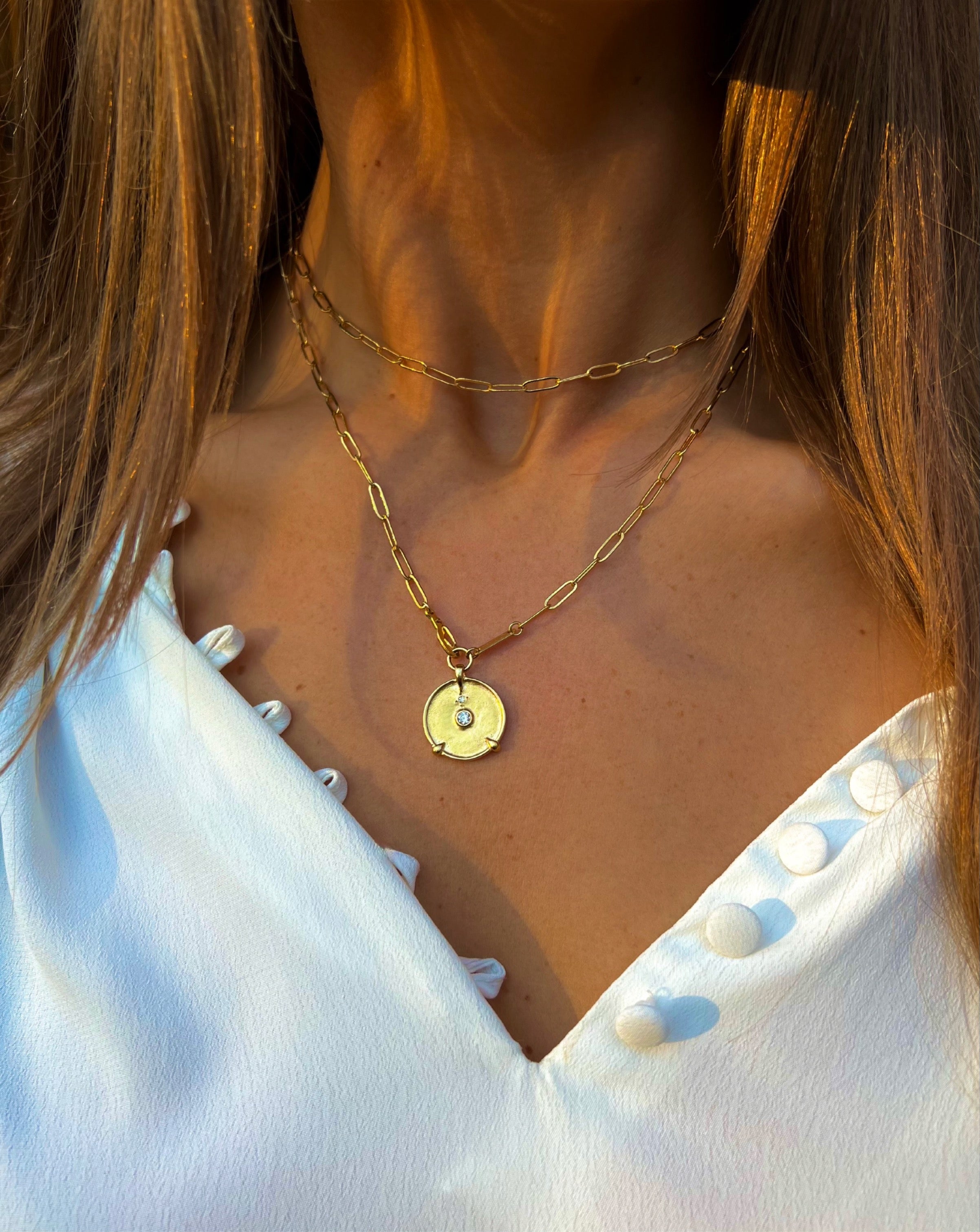 long gold necklace with brushed gold pendant hanka in falcon necklace ego medallion