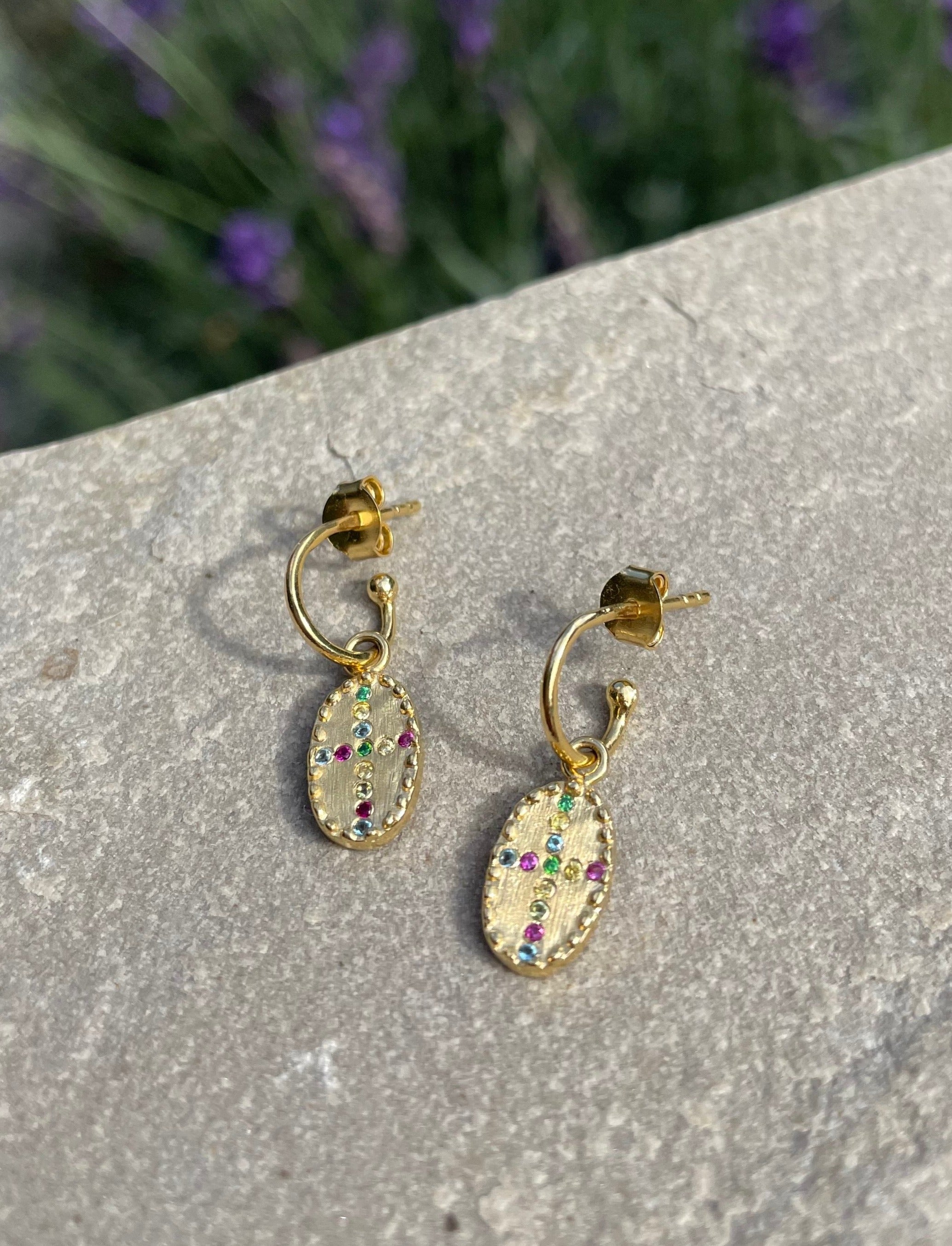 bazile earrings in rainbow louise hendricks rainbow huggie earrings