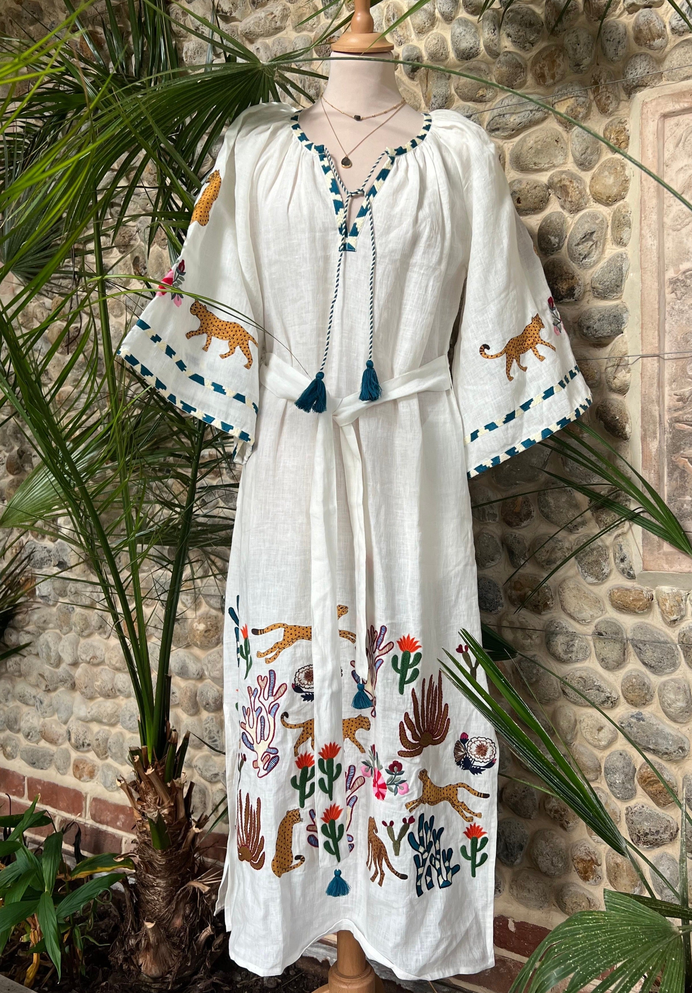 embroidered linen kaftan in white with animal print 
