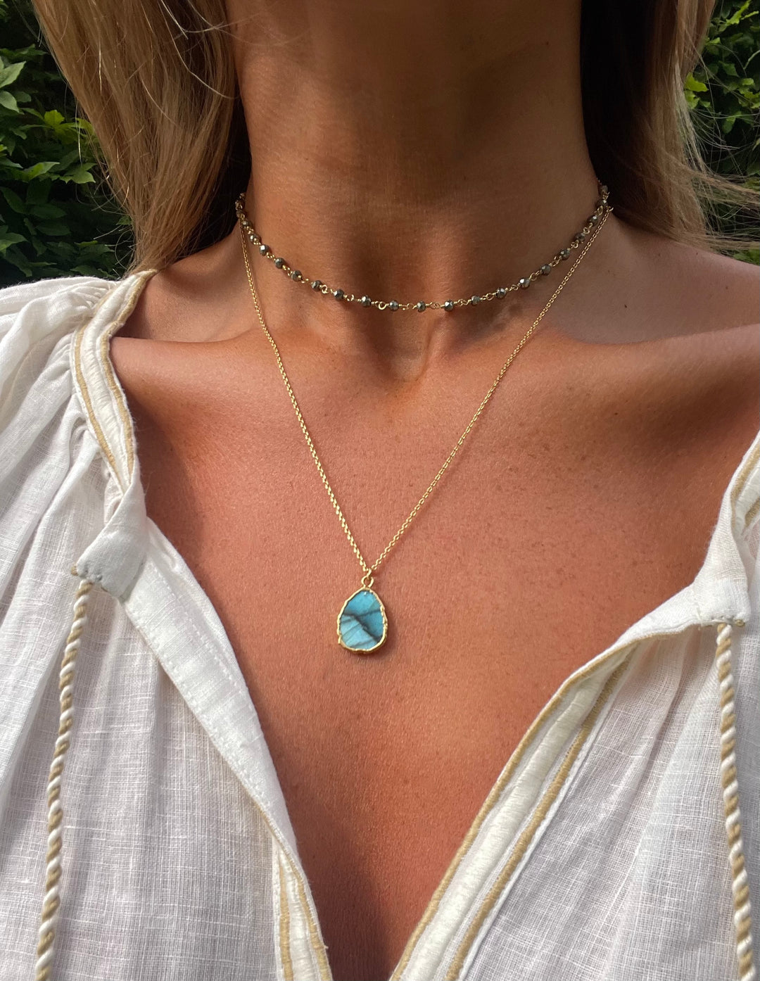 the gemma necklace by hanka in with labradorite and pyrite stones and 24k gold pated wrap around necklace or long necklace