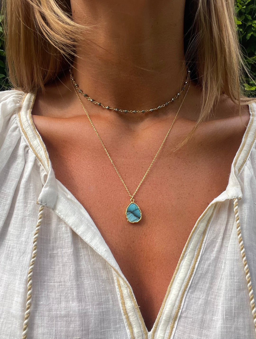 the gemma necklace by hanka in with labradorite and pyrite stones and 24k gold pated wrap around necklace or long necklace