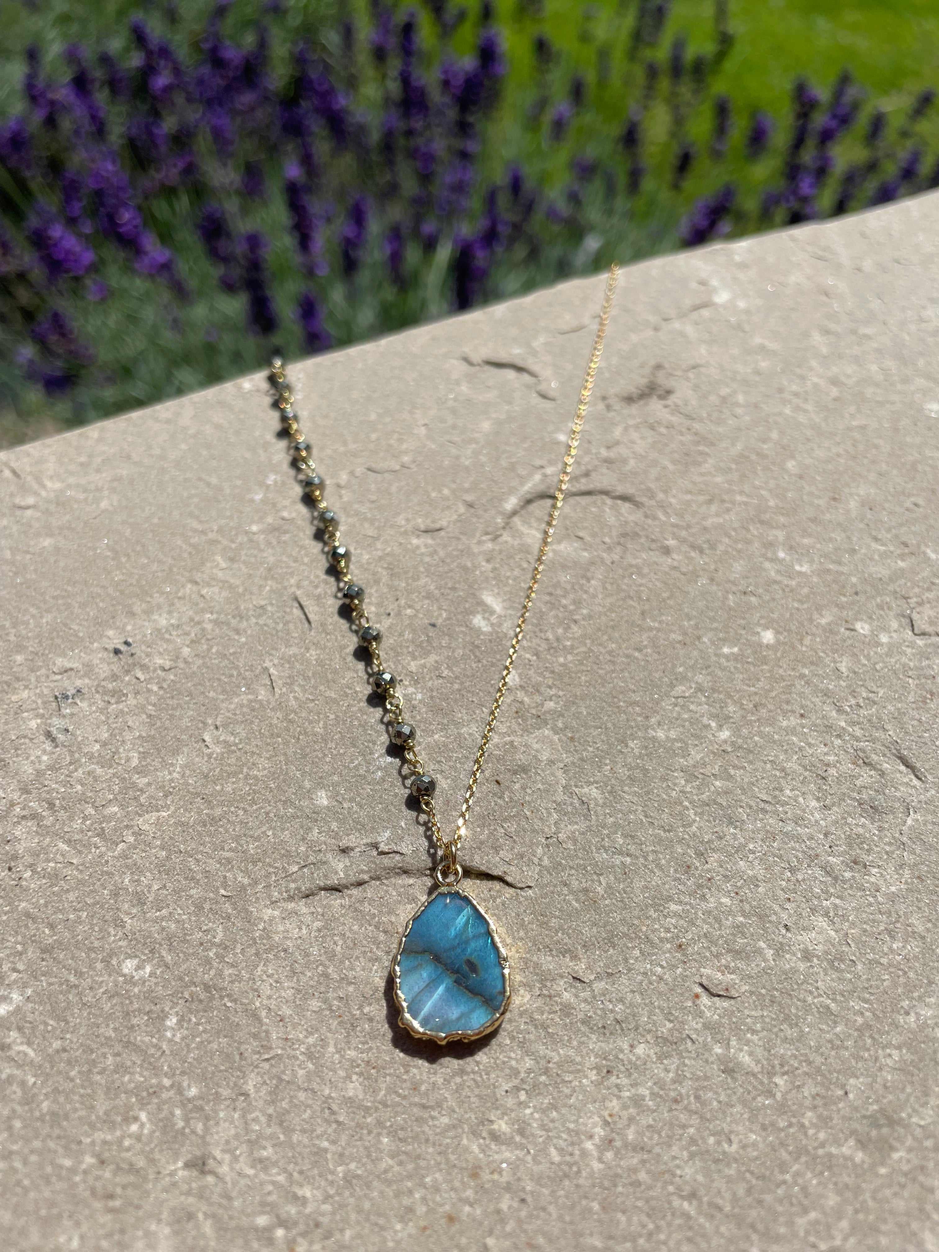 the gemma necklace by hanka in with labradorite and pyrite stones and 24k gold pated wrap around necklace or long necklace
