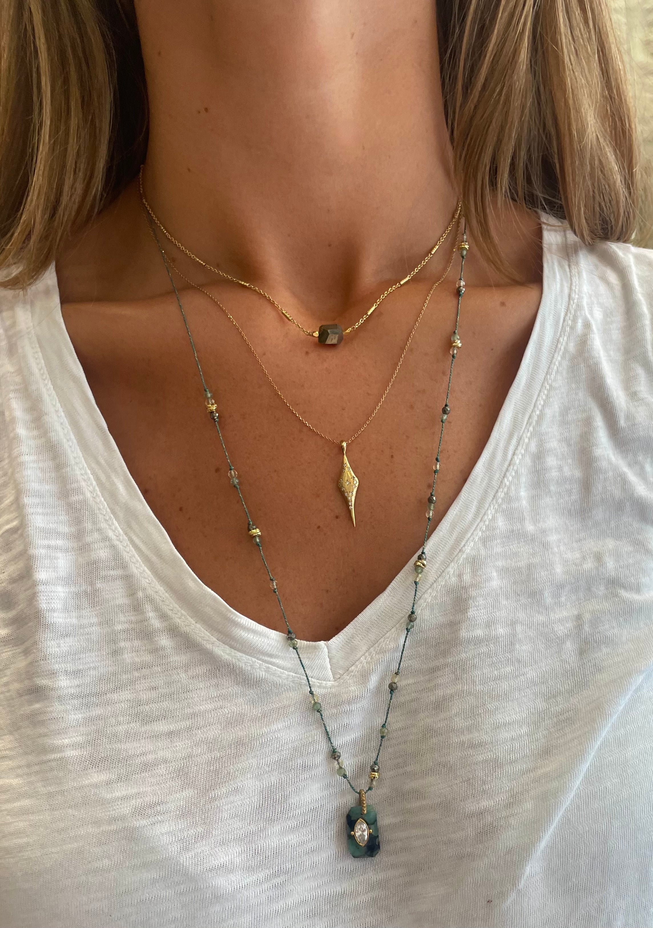 layering necklaces by hanka in pyrite, labradorite, gold plated necklaces