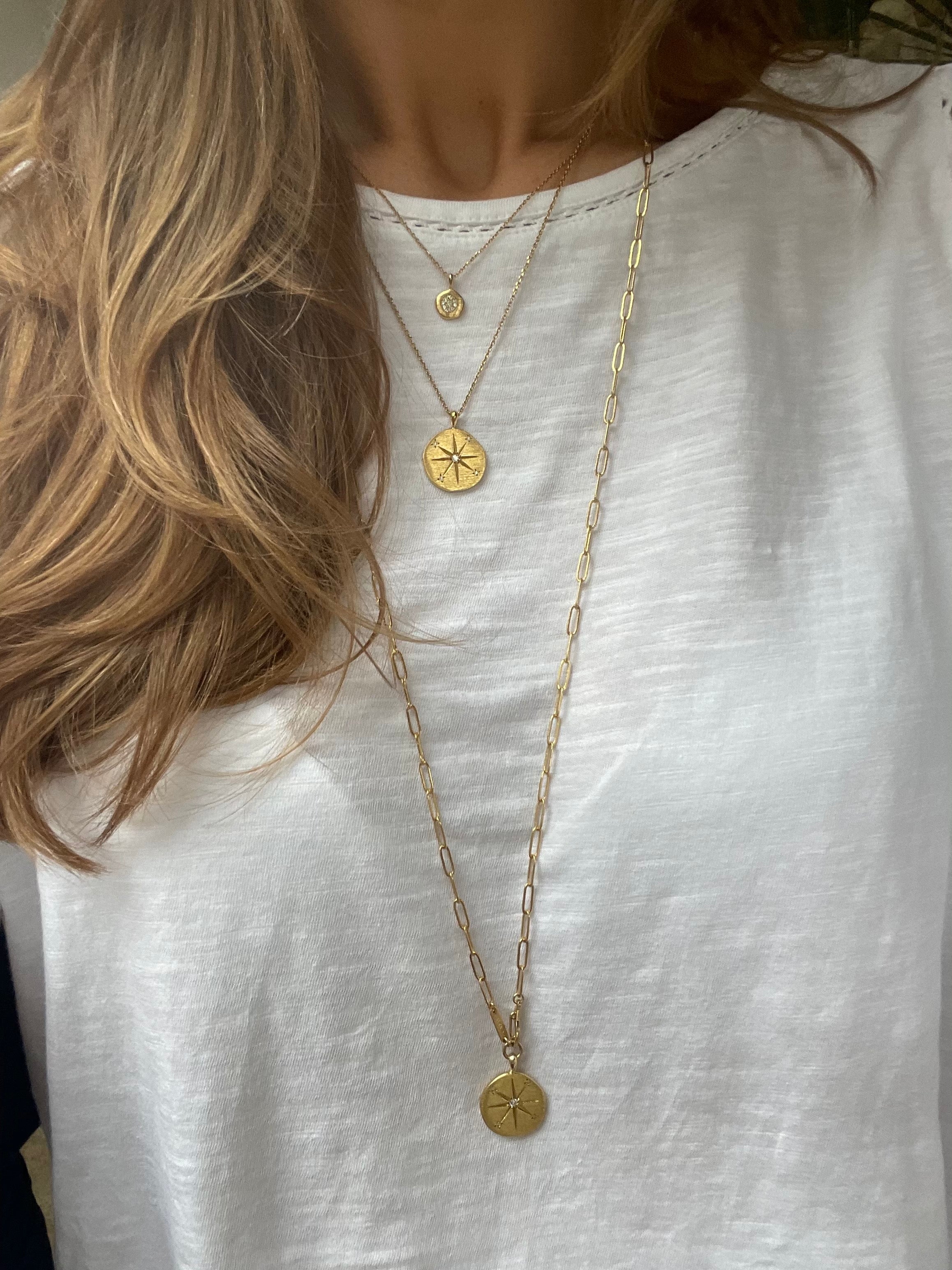 long gold link chain necklace with sun medallion