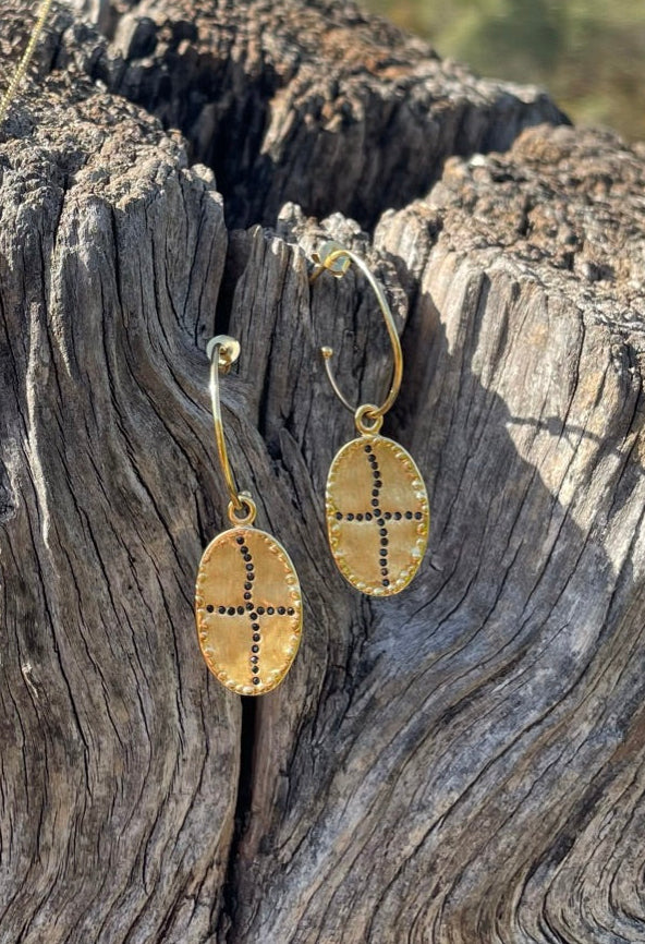 gold plated hoop earrings with gold plated pendant and black onyx stones louise hendrick bazile earrings in black