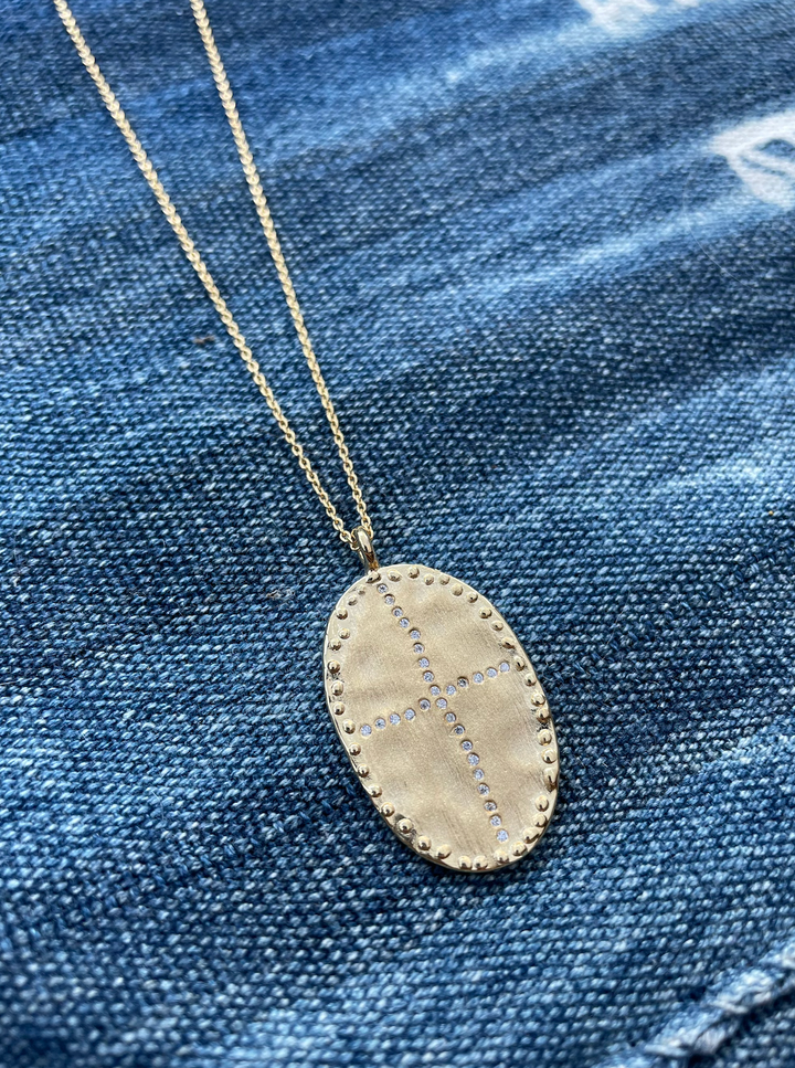 gold plated long necklace with gold pendant and white cubic zirconia stones louise hendricks bazile long necklace in white