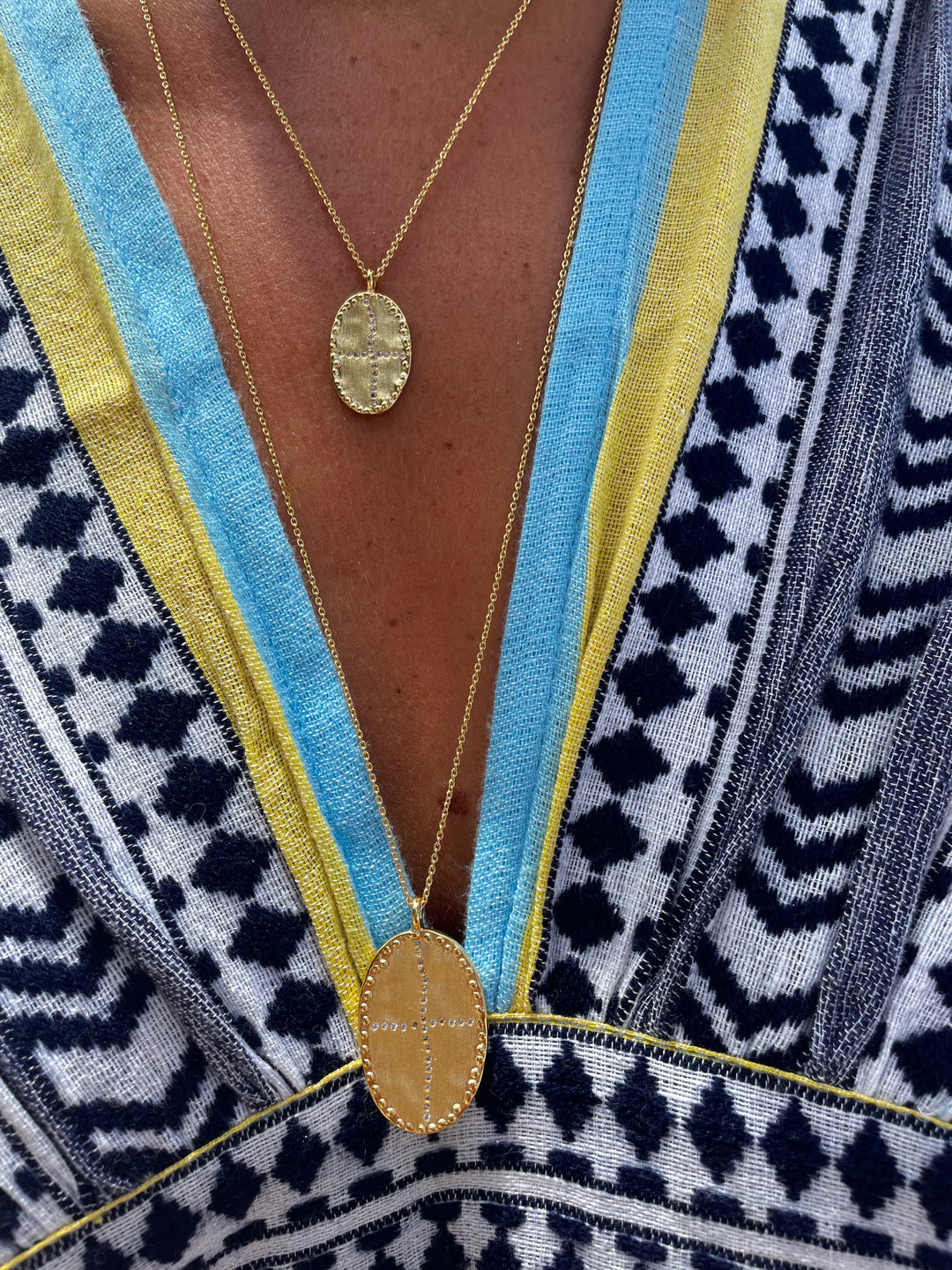 gold-plated long and short necklace brushed and matte oval white cubic zirconia in the shape of an irregular cross Louise Hendricks.