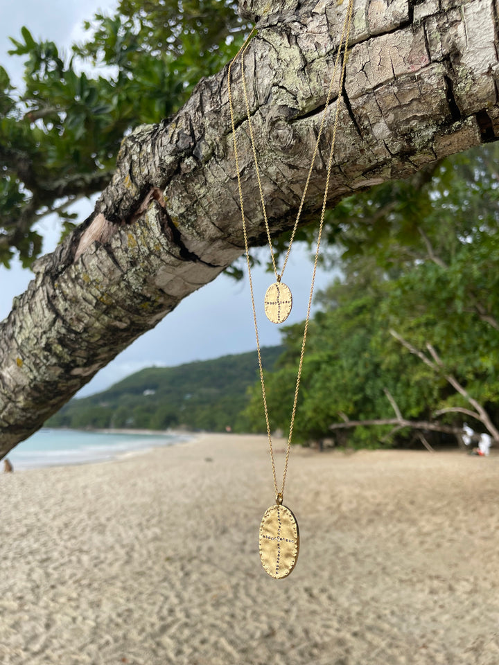 gold-plated long and short necklace,brushed and matte oval white cubic zirconia in the shape of an irregular cross Louise Hendricks.